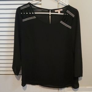 Black Blouse with design around scoop neck.